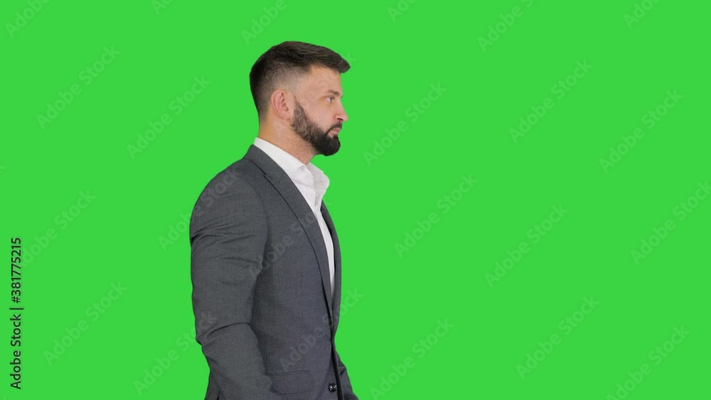 Serious turk businessman in formal suit walking on a Green Screen, Chroma Key. Serious turk businessman in formal suit walking on a Green Screen, Chroma Key.