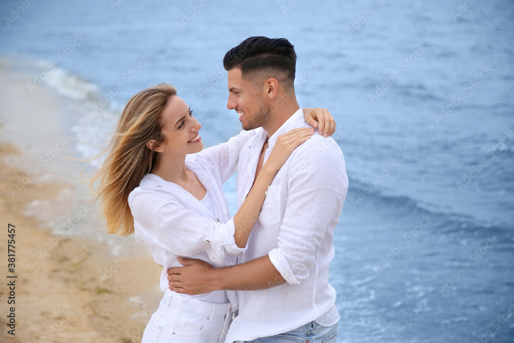 Happy couple on sea beach. Romantic walk