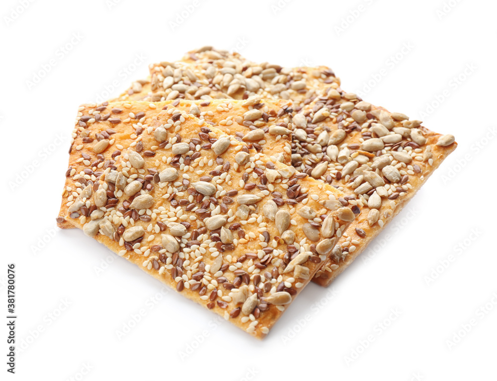 Delicious crispy crackers with different seeds isolated on white Delicious crispy crackers with different seeds isolated on white