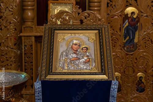 An orthodox icon on a church pulpit. When worshipers enter the church they will kiss this icon and cross themselves.