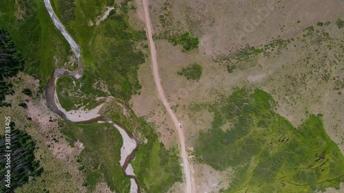 Wallpaper Mural Bird’s eye view, Scenic view of Rough Road and Landscape in San Juan Mountain Range in Colorado, Car Parked in the middle of the road. Torontodigital.ca