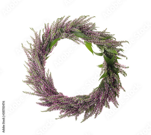 Beautiful autumnal wreath with heather flowers isolated on white