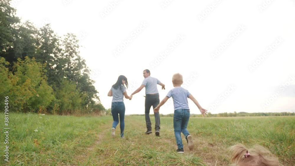 happy family children kid together run in the park at sunset silhouette. people in park concept mom dad daughter and son joyful run. happy family fun and little baby child summer kid dream concept happy family children kid together run in the park at sunset silhouette. people in park concept mom dad daughter and son joyful run. happy family fun and little baby child summer kid dream concept