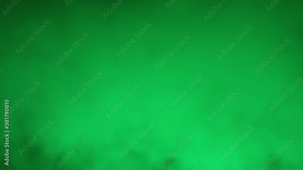 Halloween spooky green smoke on black dark background. Scary mist paranormal condensation. Glowing horror fog in the darkness. You can use the clip as it is or as overlay backdrop.