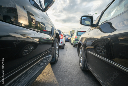 Cars on city street in traffic jam at rush hour © Hanoi Photography