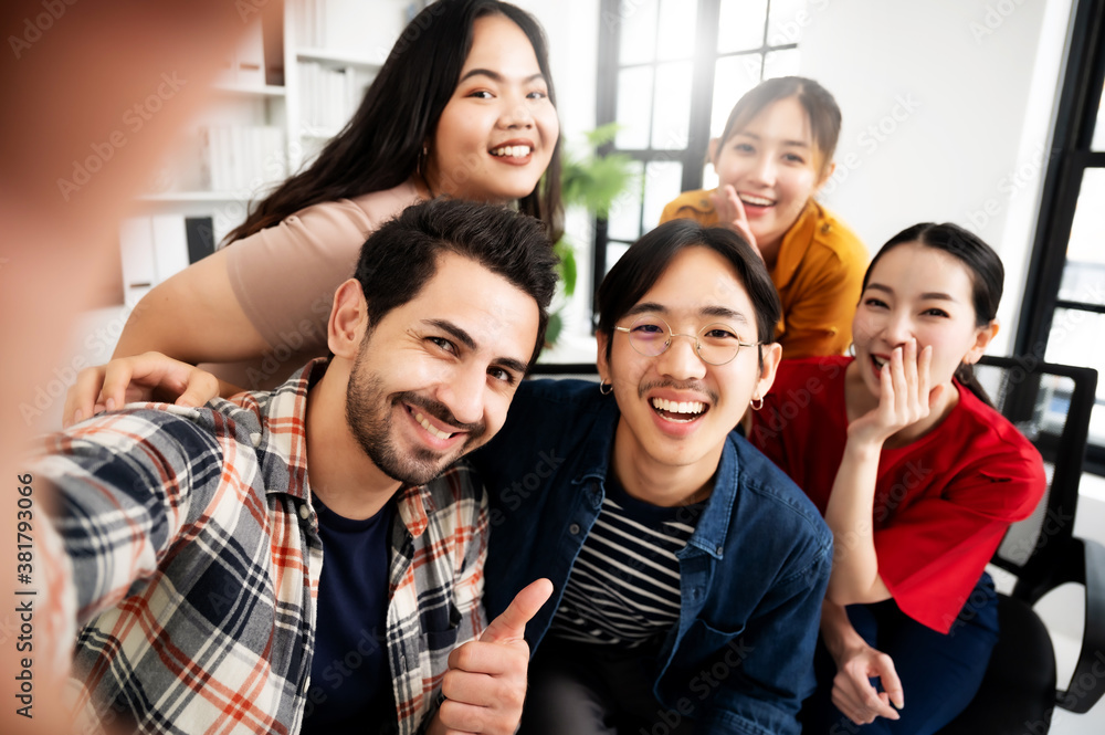 Selfie of group young man and woman team smiling having fun together Selfie of group young man and woman team smiling having fun together