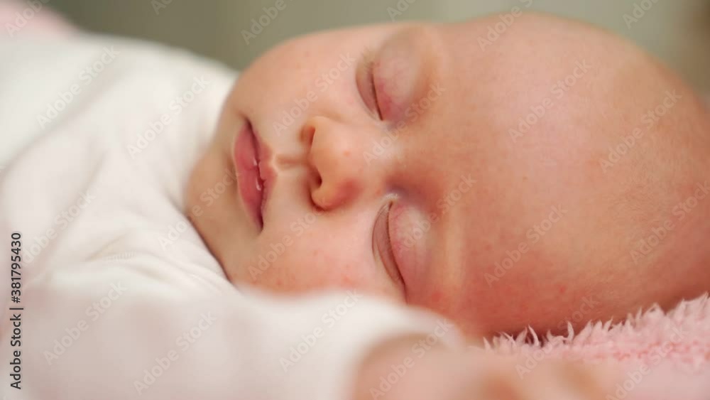 close up sleeping baby under pink blanket. mode of day,healthy sleep in newborns close up sleeping baby under pink blanket. mode of day,healthy sleep in newborns