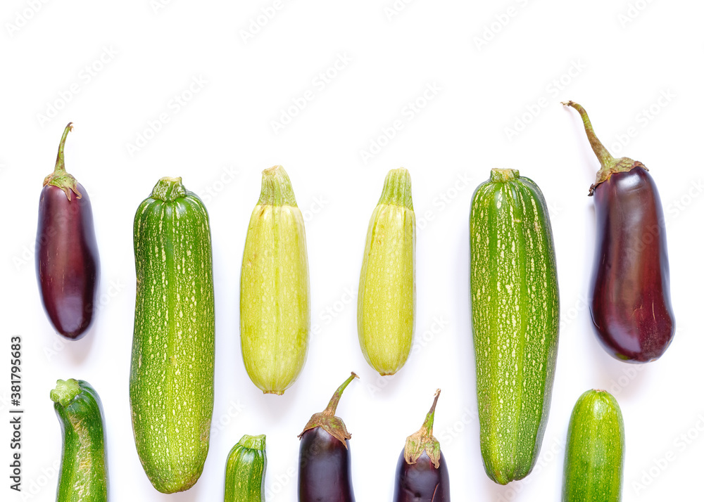 Autumn composition. Pattern from vegetables. Whole ripe zucchini and eggplants are on a white background. Autumn, Fall concept. Harvesting. Food ingredients. Flat lay. Autumn composition. Pattern from vegetables. Whole ripe zucchini and eggplants are on a white background. Autumn, Fall concept. Harvesting. Food ingredients. Flat lay.