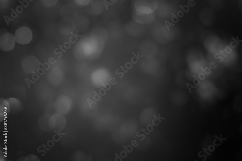 Dark blurred christmas lights background. Design effect focus happy holiday party glow texture black wallpaper bokeh sun sunny star shiny soft plain warm flare blur night light new year.