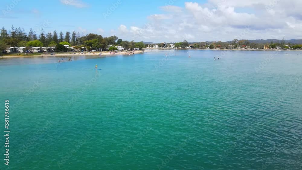 People enjoying the turquoise waters -Tallebudgera Creek Queensland Australia People enjoying the turquoise waters -Tallebudgera Creek Queensland Australia
