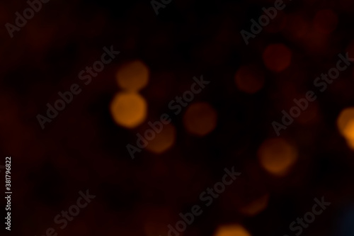 Bokeh background or multiple orange dots on black background