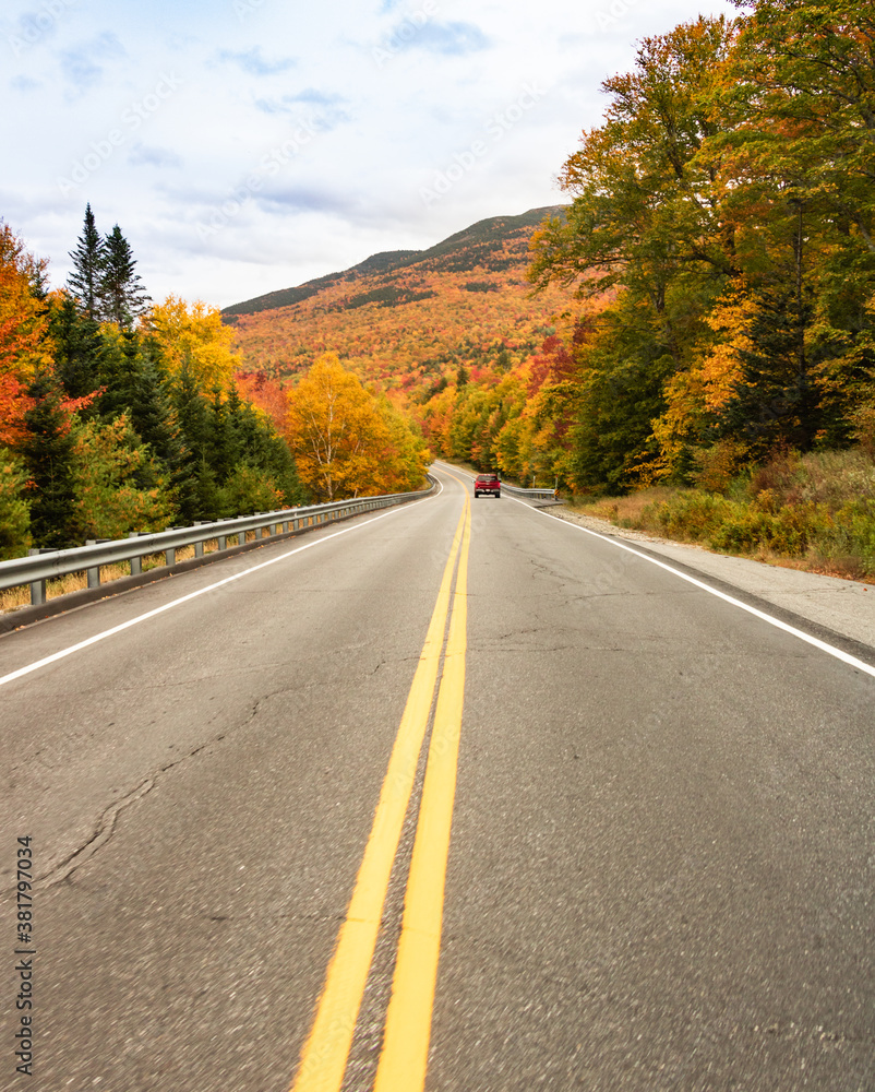 Autumn passage way with colorful trees on the hills Autumn passage way with colorful trees on the hills