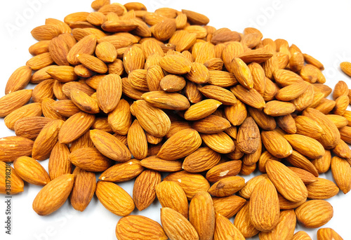 groups of almonds on white back ground photo