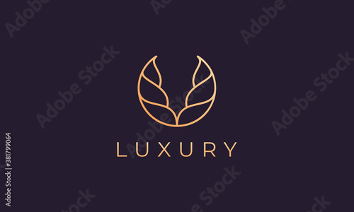 Gold abstract logo template with luxurious and elegant curved shapes