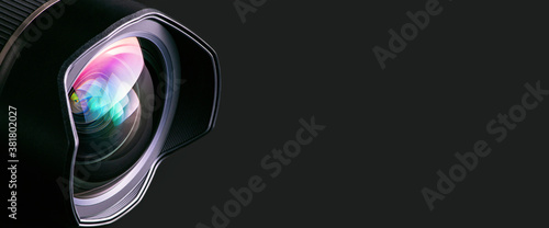Fotografi .Camera lens on a black background. Wide-angle close-up lens. Macro. Banner.
