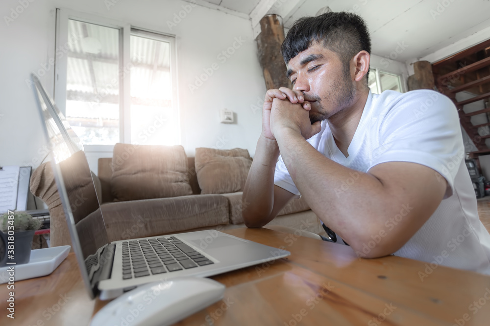 Man praying with computer laptop, Online church in home, Home church during quarantine coronavirus Covid-19, Religion concept Man praying with computer laptop, Online church in home, Home church during quarantine coronavirus Covid-19, Religion concept