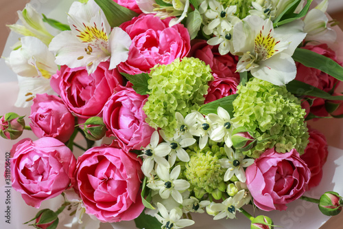 Pink-green bouquet of roses  white lilies  hydrangeas close up