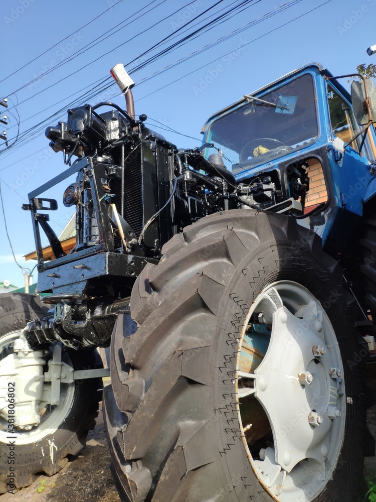 repair of the tractor. a tractor with a disassembled engine repair of the tractor. a tractor with a disassembled engine