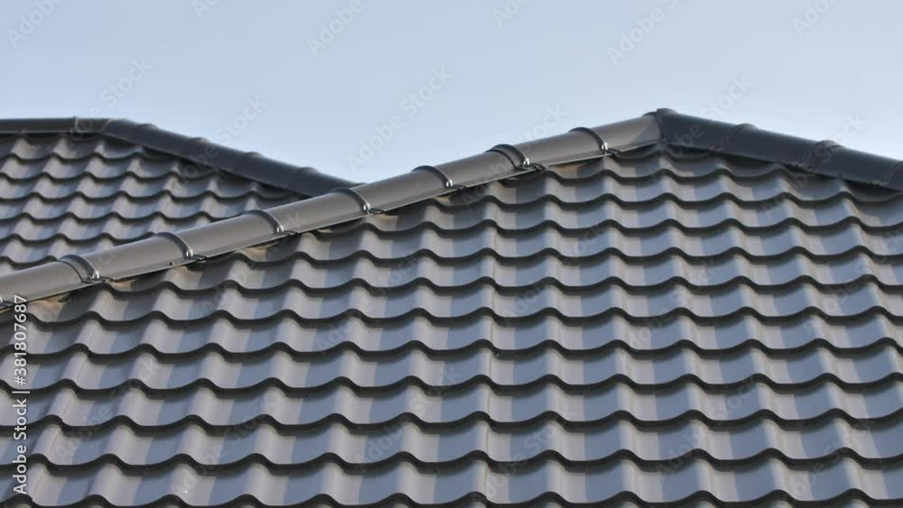 Modern Corrugated Metal Roofing. Roof Made of Metal Tiles Close Up Modern Corrugated Metal Roofing. Roof Made of Metal Tiles Close Up