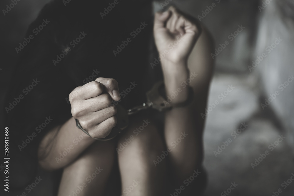 The slave girl was handcuffed and kept in a cage. Imprisonment, Female prisoner, Women violence and abused concept,  human trafficking Concept, international women's day.