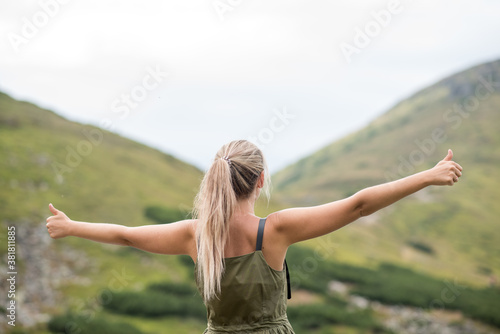woman in the mountains. person in the mountains. Young woman showing class in the mountains