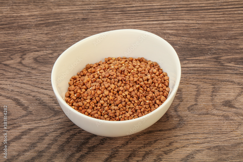 Raw buсkwheat cereal in the bowl Raw buсkwheat cereal in the bowl