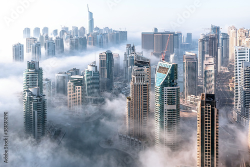 Aerial view of Dubai skyline. Morning mist hovering Dubai Marina