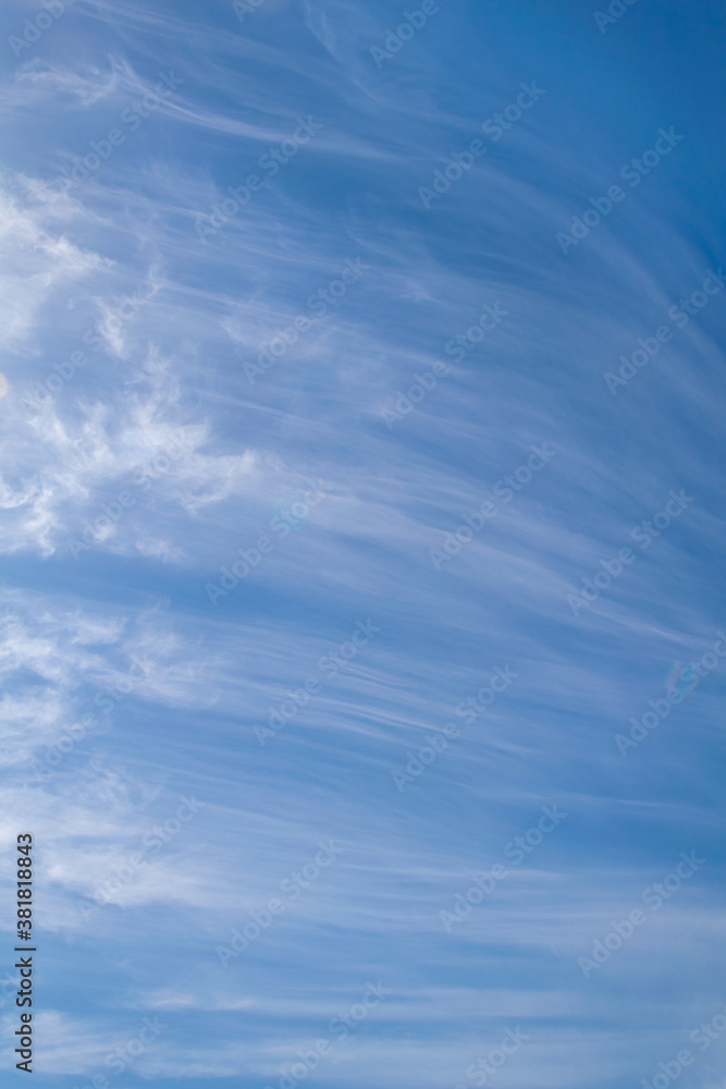 thin white clouds on a blue sky background during summer in Marbella thin white clouds on a blue sky background during summer in Marbella