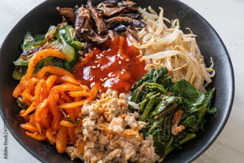 Korean spicy salad with rice - traditionally Korean food, Bibimbap photo