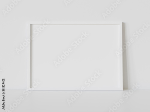 White frame leaning on white floor in interior mockup. Template of a picture framed on a wall 3D rendering