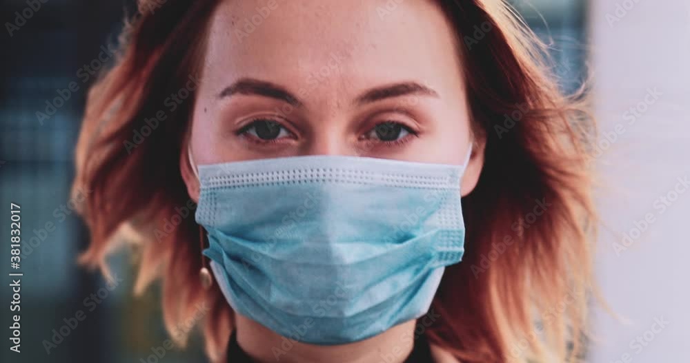 Portrait Of A Business Woman Wearing A Protective Mask Walking In The City. SLOW MOTION Gimbal Stabilized. Student in a medical face mask against air pollution and coronavirus Covid19 commuting. Portrait Of A Business Woman Wearing A Protective Mask Walking In The City. SLOW MOTION Gimbal Stabilized. Student in a medical face mask against air pollution and coronavirus Covid19 commuting.