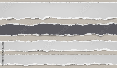 Pieces of torn, ripped black and white paper with soft shadow are on brown background for text. Vector illustration