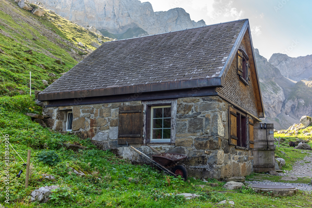 Typical Appenzell wooden cabins in the Swiss alps in a fall misty morning Typical Appenzell wooden cabins in the Swiss alps in a fall misty morning