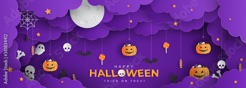 Happy Halloween banner or with night clouds and pumpkins filled with Halloween decorations in paper cut style. Vector illustration. Full moon in the sky, spider webs and bats flying. Place for text
