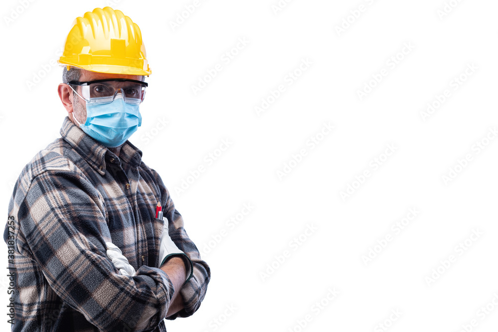 Carpenter worker isolated on white background, wears helmet, goggles, leather gloves and surgical mask to prevent coronavirus infection. Preventing Pandemic Covid-19 at the workplace. Carpenter worker isolated on white background, wears helmet, goggles, leather gloves and surgical mask to prevent coronavirus infection. Preventing Pandemic Covid-19 at the workplace.