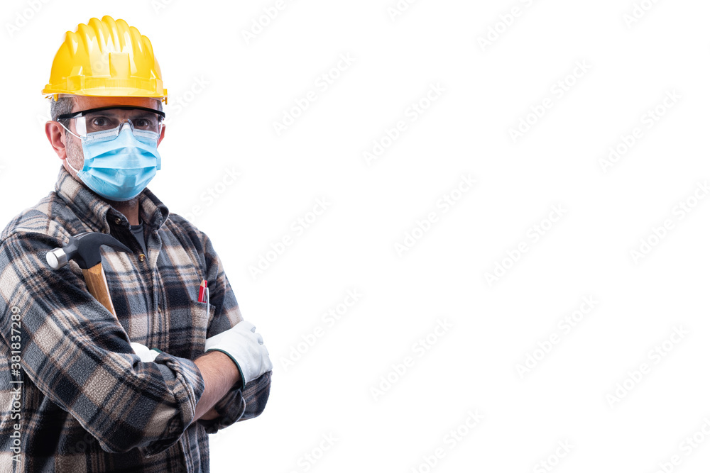 Carpenter worker isolated on white background, wears helmet, goggles, leather gloves and surgical mask to prevent coronavirus infection. Preventing Pandemic Covid-19 at the workplace. Carpenter worker isolated on white background, wears helmet, goggles, leather gloves and surgical mask to prevent coronavirus infection. Preventing Pandemic Covid-19 at the workplace.