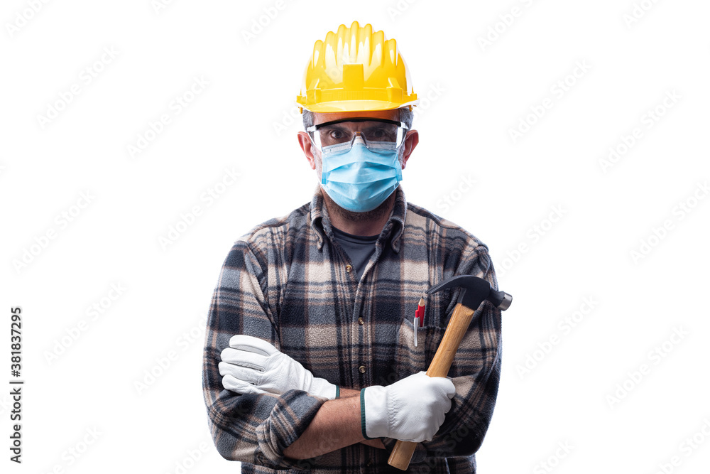 Carpenter worker isolated on white background, wears helmet, goggles, leather gloves and surgical mask to prevent coronavirus infection. Preventing Pandemic Covid-19 at the workplace. Carpenter worker isolated on white background, wears helmet, goggles, leather gloves and surgical mask to prevent coronavirus infection. Preventing Pandemic Covid-19 at the workplace.