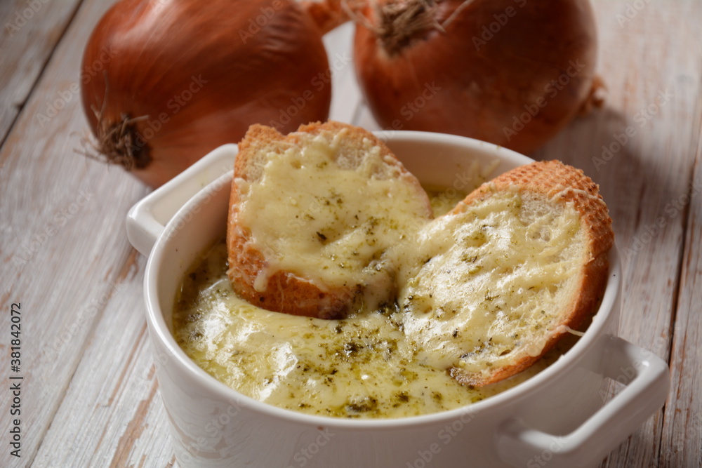 French Onion Soup with toasted bread and cheddar cheese French Onion Soup with toasted bread and cheddar cheese