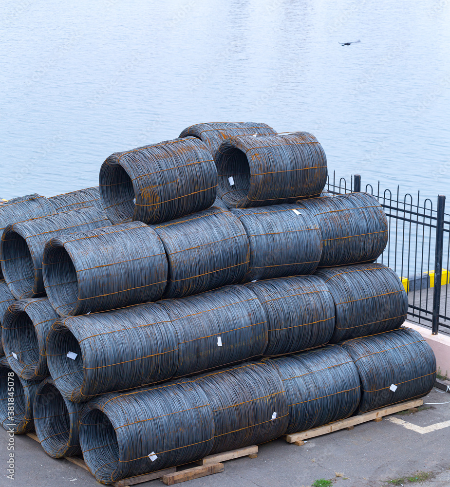 Steel low carbon wire rod, hot rolled steel drawing wire twelve millimeters or half an inch in diameter in coils. Freight transportation of heavy industry products by seaports. Export-import activity. Steel low carbon wire rod, hot rolled steel drawing wire twelve millimeters or half an inch in diameter in coils. Freight transportation of heavy industry products by seaports. Export-import activity.