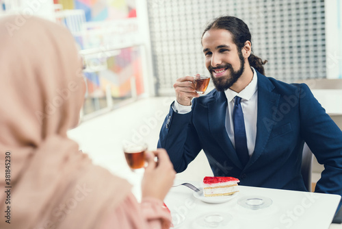 Arabian Couple Sitting in Cafe after Shopping.