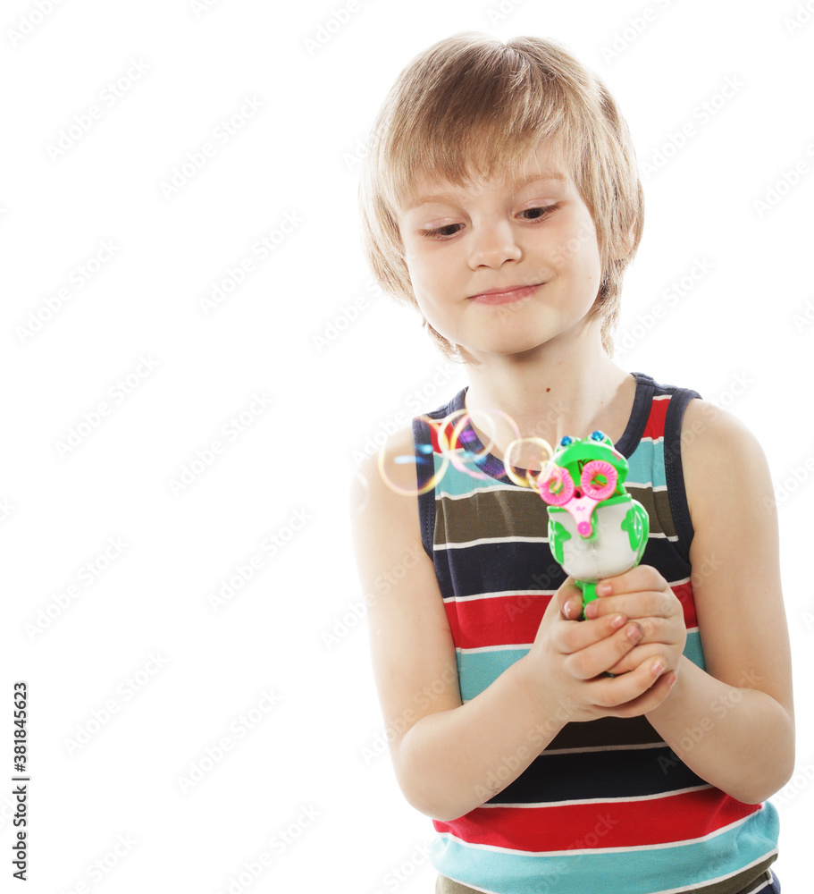 caucasian boy blowing soap bubbles caucasian boy blowing soap bubbles