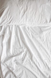 White linens on the bed 