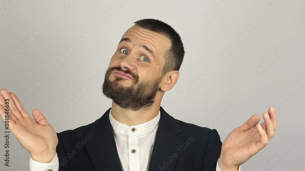 Handsome young man sarcastically smiles and claps his hands. Handsome young man sarcastically smiles and claps his hands.