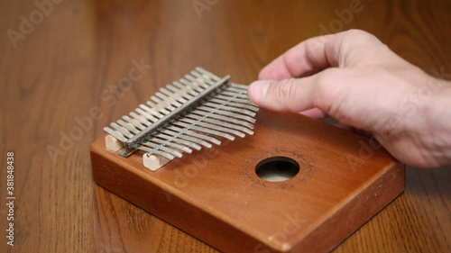 play on kalimba on the table close-up