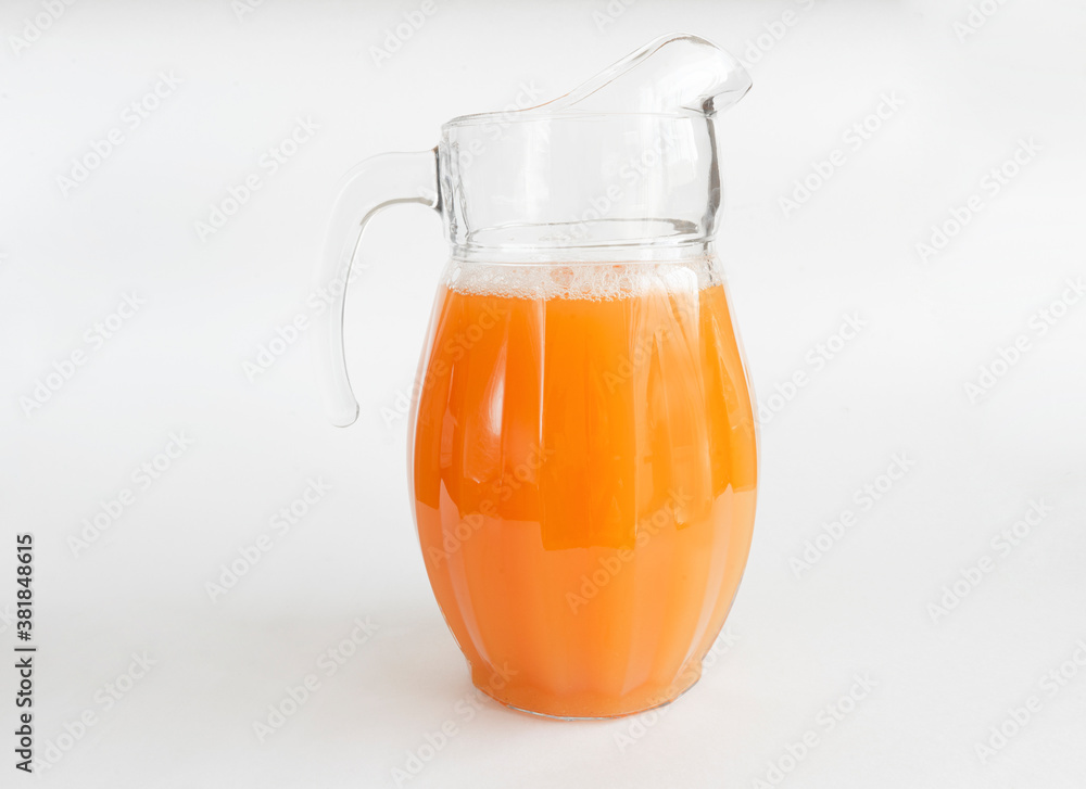 Orange juice in pitcher. Isolated on white background. Copy space Orange juice in pitcher. Isolated on white background. Copy space
