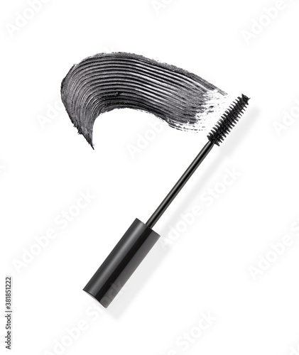 Black mascara brush stroke with applicator brush isolated on white	
 photo