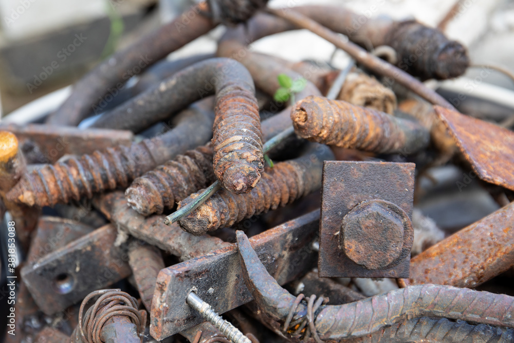 Scrap metal stack. fittings, screws, parts and wires. Waste sorting and care for the environment Scrap metal stack. fittings, screws, parts and wires. Waste sorting and care for the environment