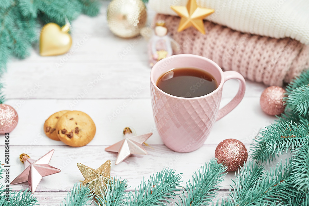 Christmas table setting. Cup of coffee or tea on background of Christmas tree. Christmastime celebration. Winter Holidays. Xmas mock up. Greeting card template. Christmas table setting. Cup of coffee or tea on background of Christmas tree. Christmastime celebration. Winter Holidays. Xmas mock up. Greeting card template.
