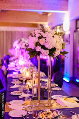 Beautifully decorated wedding table and other details at wedding hall. Wedding day.