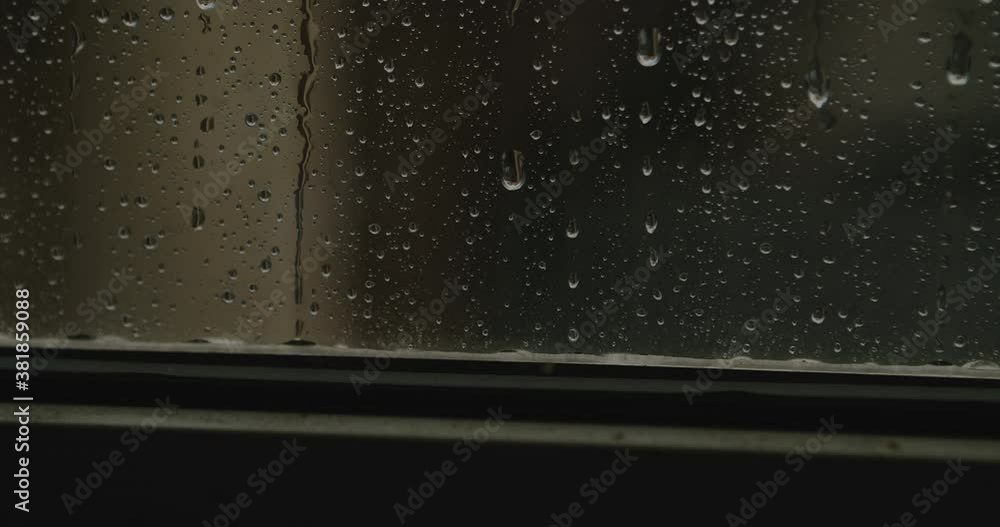 real rain drops sliding on window glass real rain drops sliding on window glass